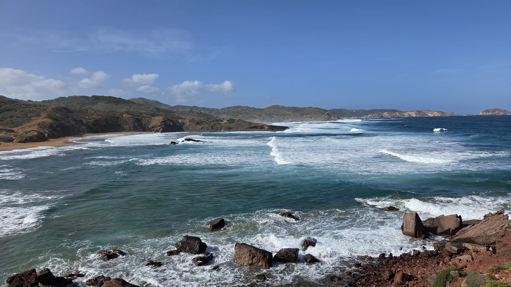 Rocky coastline and waves on the north coast of Menorca near Cala Pregonda.