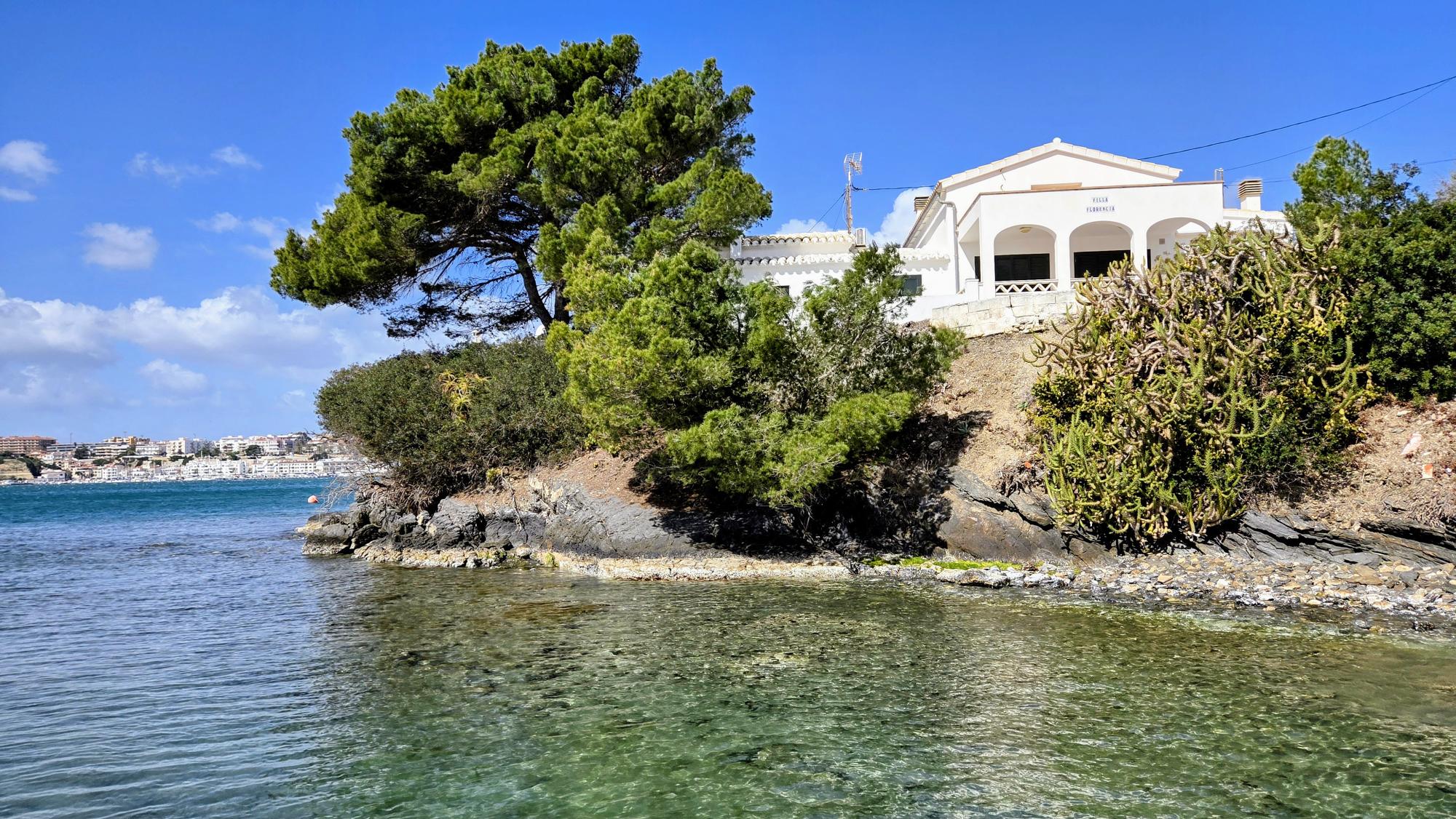 Menorca coast line with villa on water